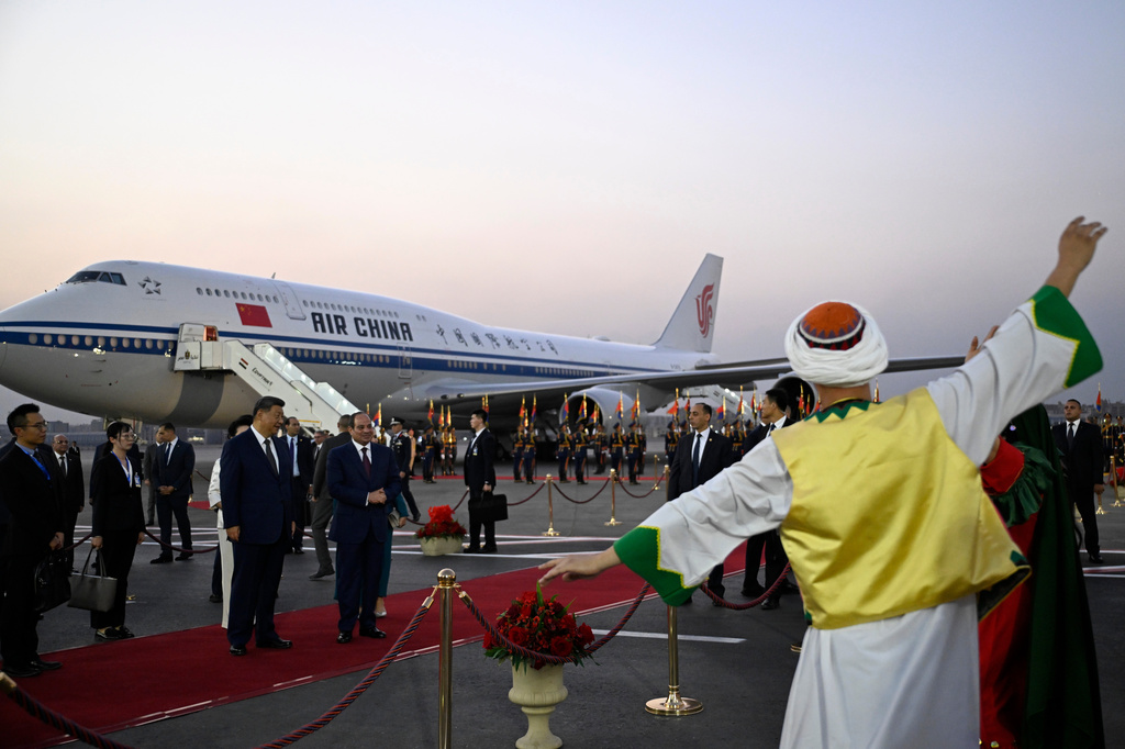 Artists perform as Chinese President Xi Jinping, centre left, is welcomed by Egyptian President Abdel-Fattah el-Sissi, centre, at Cairo International Airport in Cairo, Egypt, Tuesday, Sept. 1, 2026. (Khaled Desouki/Pool Photo via AP)