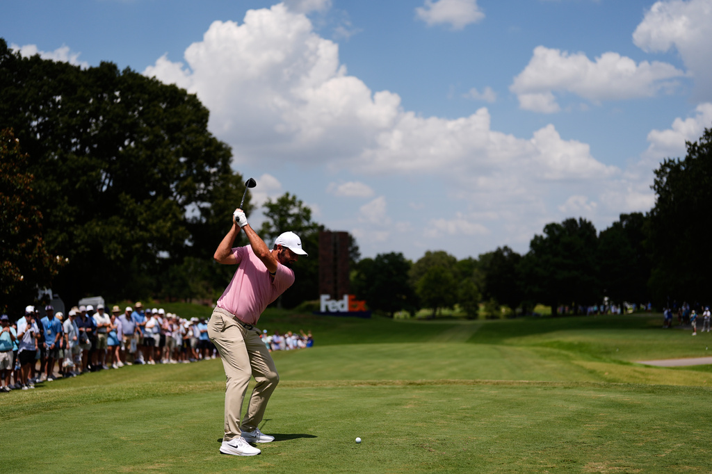 Scottie Scheffler hits on the ninth hole during the second round of the St. Jude Championship golf tournament Friday, Aug. 14, 2026, in Memphis, Tenn. (AP Photo/George Walker IV)