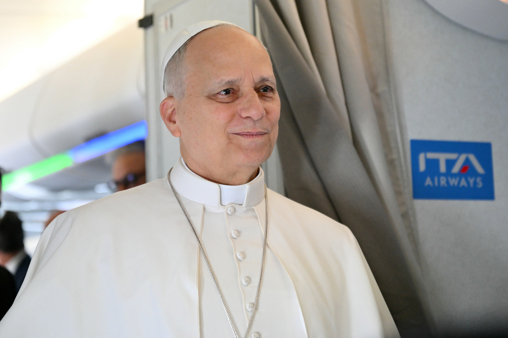 Pope Leo XIV speaks to journalists aboard his flight bound for Algiers’ Houari Boumédiène International Airport on Monday, April 13, 2026, at the start of an 11-day apostolic journey to Africa. (Alberto Pizzoli/Pool Photo via AP)