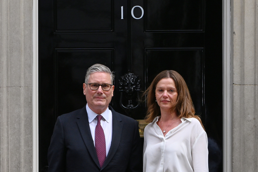 Britain's Prime Minister Keir Starmer and wife Victoria stand in front of 10 Downing Street door after after announcing his resignation in London, Monday, June 22, 2026.(AP Photo/Thomas Krych)