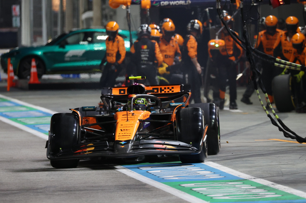 McLaren driver Lando Norris of Britain drives after getting a pit service during the Singapore Formula One Grand Prix at the Marina Bay Street Circuit in Singapore, Sunday, Oct. 5, 2025. (Fazry Ismail/Pool Photo via AP)