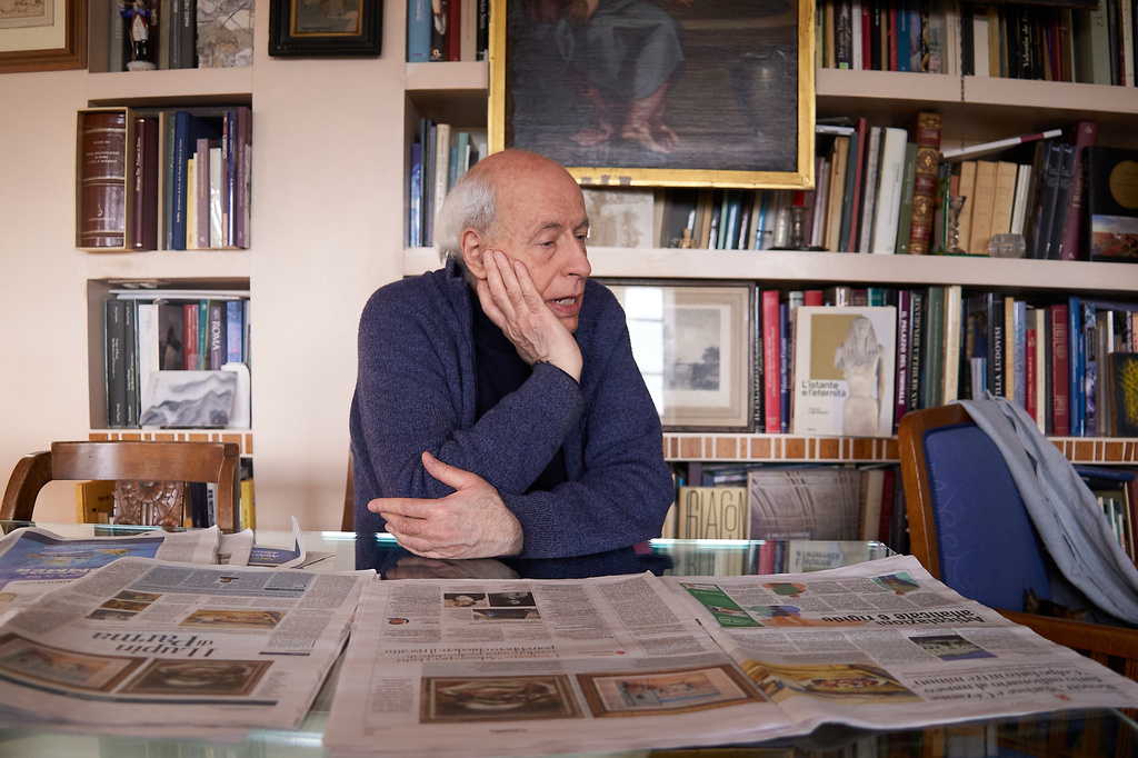 Art historian Claudio Strinati looks at newspapers reporting the theft of three paintings - Auguste Renoir's Fish, Paul Cézanne's Still Life with Cherries and Henri Matisse's Odalisque on the Terrace - from a museum near Parma in northern Italy, during an interview with The Associated Press in Rome, Monday, March 30, 2026. (AP Photo/Paolo Santalucia)