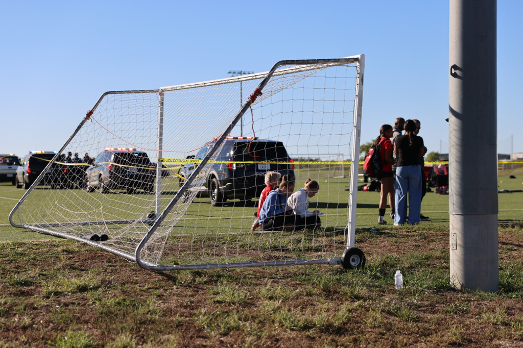 This image provided by KAKE shows police on the scene where a person drove a vehicle through a soccer field during a game in Wichita, Kansas, Saturday, Oct. 17, 2026. (Wyatt Glosson/KAKE via AP)