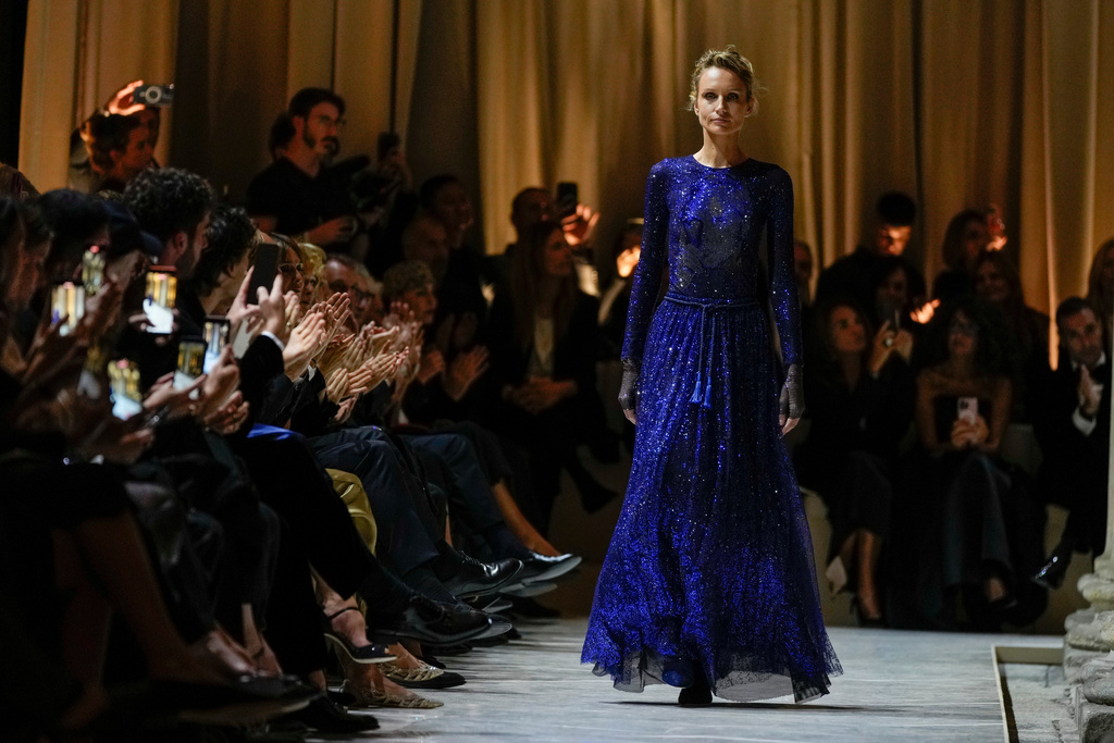 A model wears a creation as part of the Giorgio Armani Spring/Summer 2026 collection show in Milan, Italy, Sunday, Sept. 28, 2025. (AP Photo/Luca Bruno)
