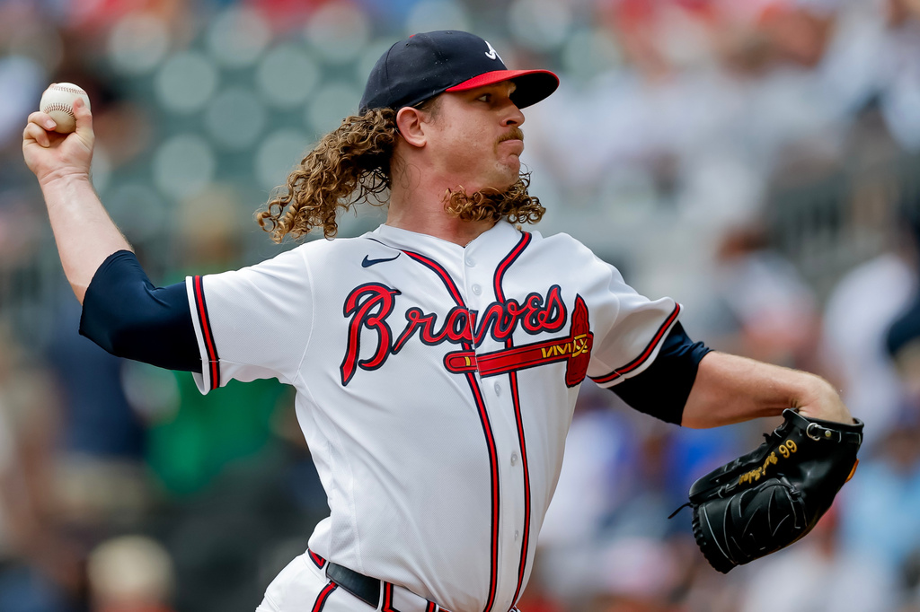 Atlanta Braves pitcher Grant Holmes delivers to a Texas Rangers batter during the first inning of a baseball game, Sunday, July 19, 2026, in Atlanta. (AP Photo/Erik S. Lesser)