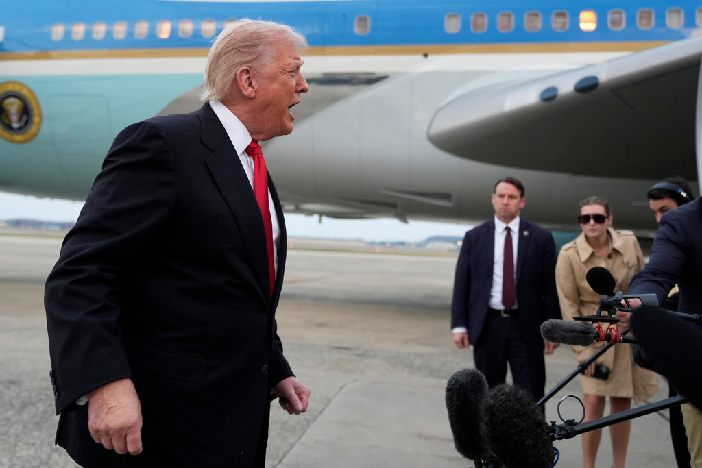 President Donald Trump speaks with reporters upon arriving on Air Force One at Joint Base Andrews, Md., Sunday, Nov. 9, 2025, on his way to attend a football game between the Washington Commanders and the Detroit Lions in Maryland. (AP Photo/Manuel Balce Ceneta)