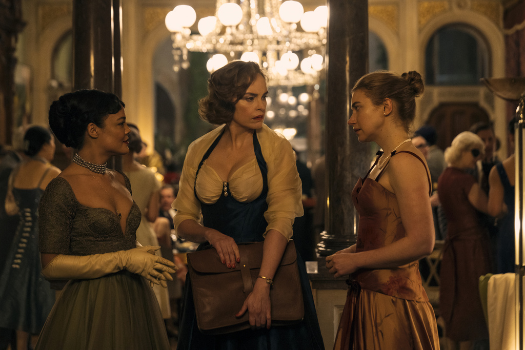 This image released by Amazon Prime shows Tessa Thompson, from left, Nina Hoss and Imogen Poots in a scene from "Hedda." (Parisa Taghizadeh/Amazon Prime via AP)