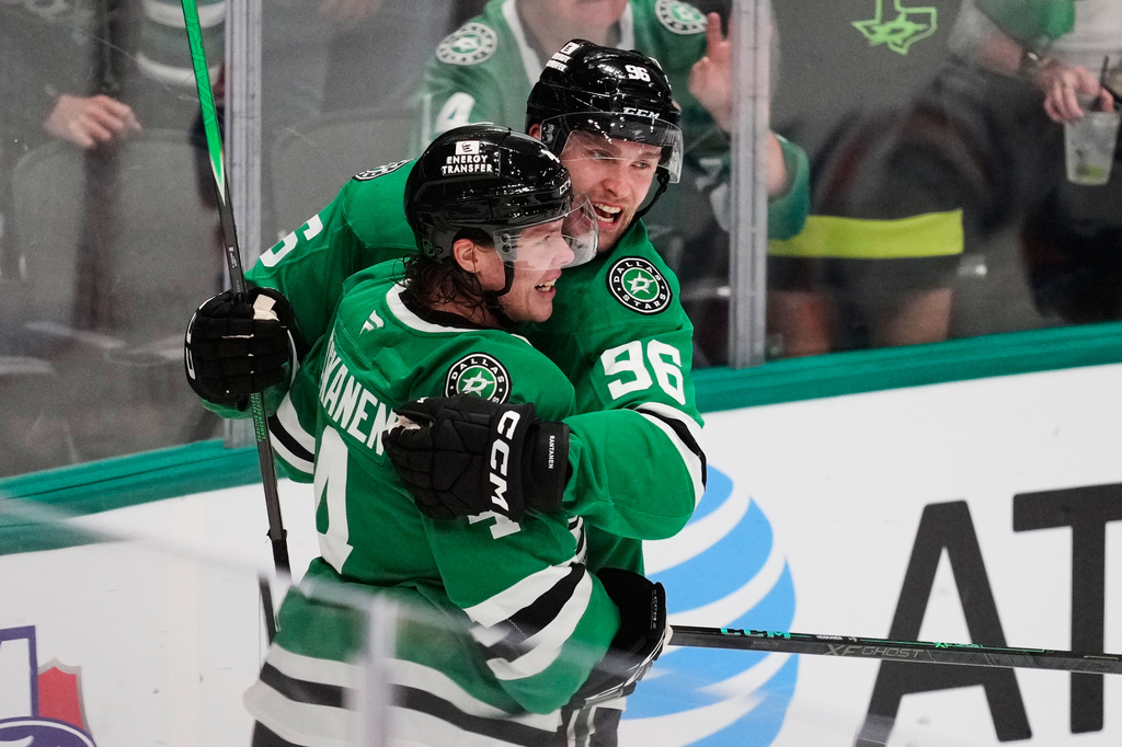 Dallas Stars' Miro Heiskanen (4) and Mikko Rantanen (96) celebrate after Heiskanen scored in the third period of an NHL hockey game against the Edmonton Oilers Tuesday, Nov. 4, 2025, in Dallas. (AP Photo/Tony Gutierrez)
