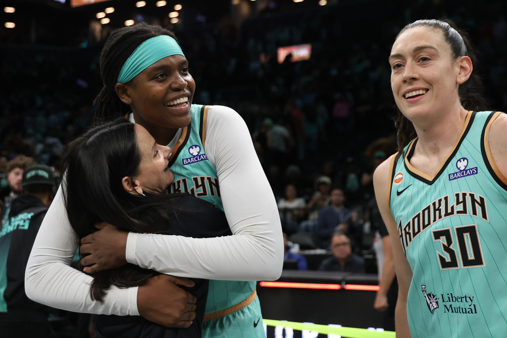Toronto Tempo head coach Sandy Brondello hugs New York Liberty center Jonquel Jones after a WNBA basketball game, Wednesday, June 3, 2026, in New York. (AP Photo/Heather Khalifa)