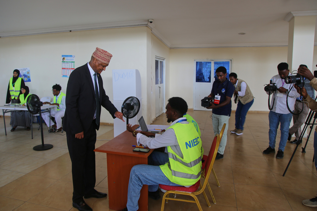 Somalia's former deputy prime minister Mahdi Mohamed Guled casts his vote during the local election in Mogadishu, Somalia, Thursday, Dec. 25, 2025. (AP Photo/Farah Abdi Warsameh)