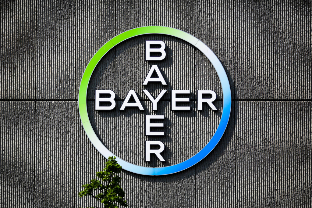 FILE - The Bayer AG corporate logo is displayed on a building of the German drug and chemicals company in Berlin, May 23, 2016. (AP Photo/Markus Schreiber, File)