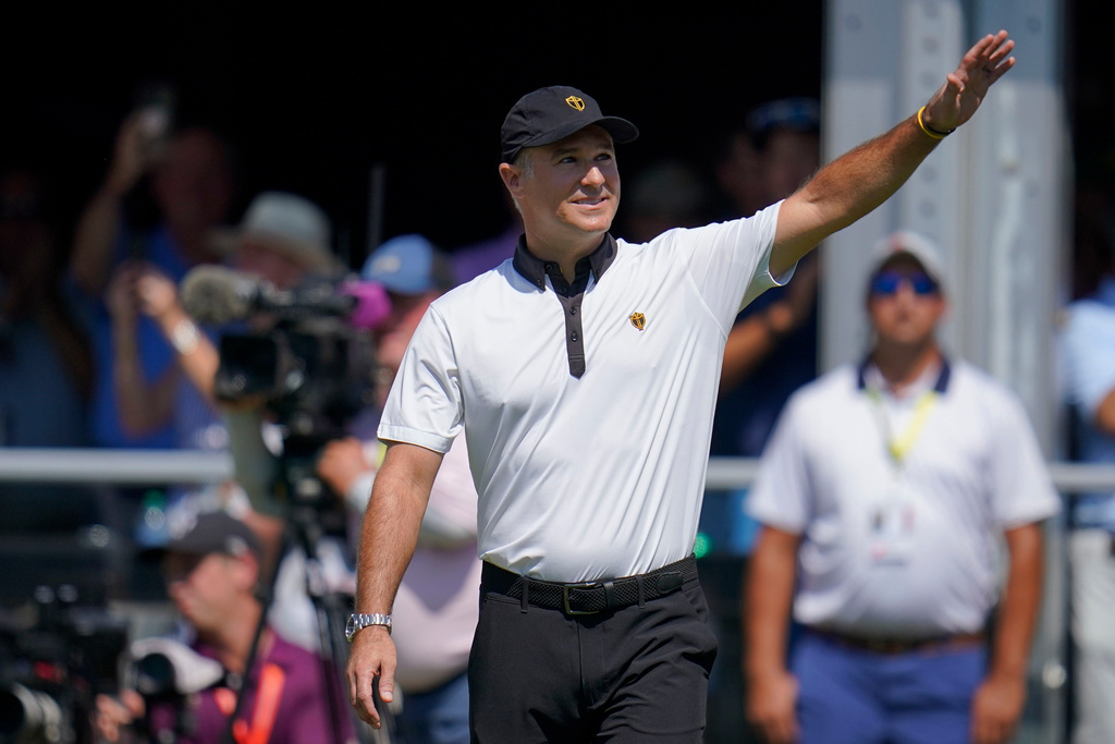 FILE - International team captain Trevor Immelman waves toward the gallery before a foursomes match at the Presidents Cup golf tournament at the Quail Hollow Club, Sept. 22, 2022, in Charlotte, N.C. (AP Photo/Julio Cortez, File)