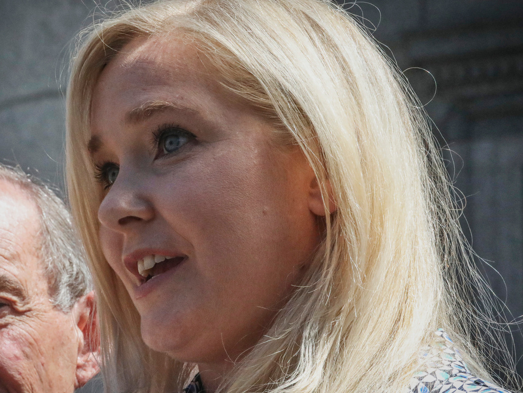 FILE - Virginia Giuffre holds a news conference outside a Manhattan court in New York, Aug. 27, 2019. (AP Photo/Bebeto Matthews, File)