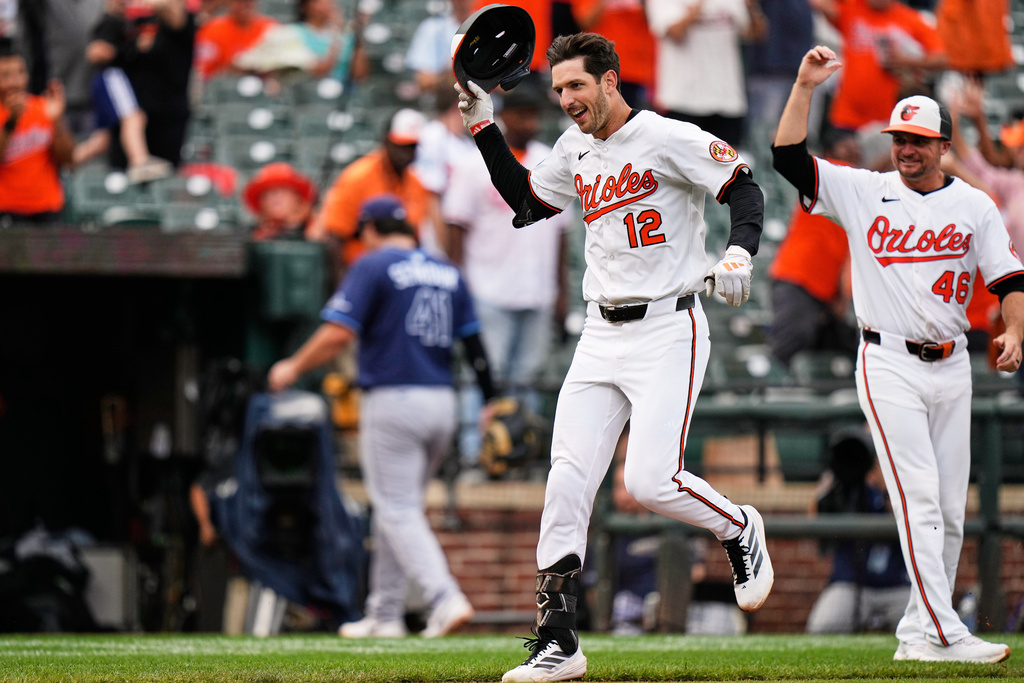 Baltimore Orioles' Dylan Beavers (12) celebrates after hitting a walk-off home run in the ninth inning of a baseball game against the Tampa Bay Rays, Thursday, Sept. 25, 2025, in Baltimore. (AP Photo/Stephanie Scarbrough)