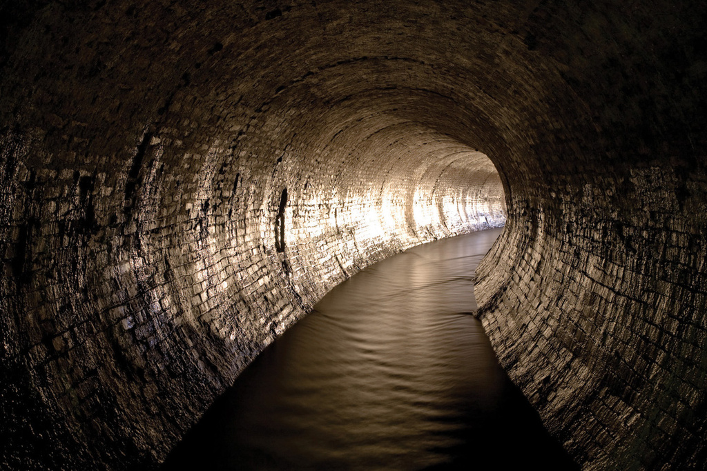 This undated photo provided by Steve Duncan shows the Tibbetts Brook sewer in the Bronx borough of New York. (Steve Duncan via AP)