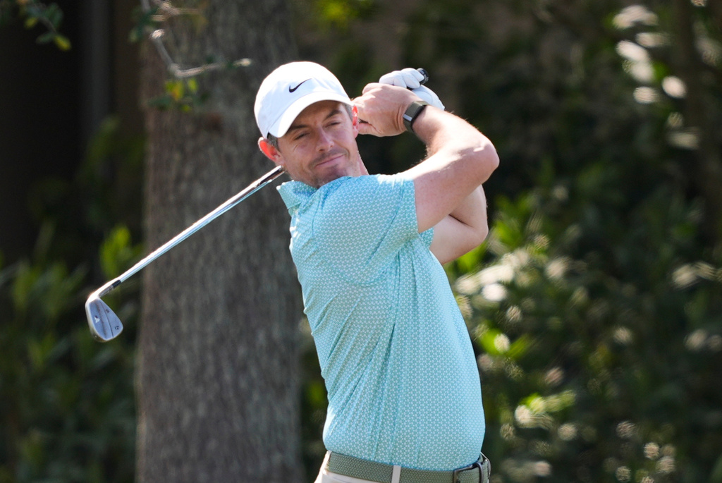 Rory McIlroy, of Northern Ireland, reacts while hitting practice shots during a practice round for The Players Championship golf tournament Wednesday, March 11, 2026, in Ponte Vedra Beach, Fla. (AP Photo/Gerald Herbert)