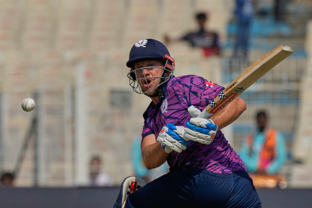 Scotland's George Munsey plays a shot during the T20 World Cup cricket match between Italy and Scotland in Kolkata, India, Monday, Feb. 9, 2026. (AP Photo/Bikas Das)
