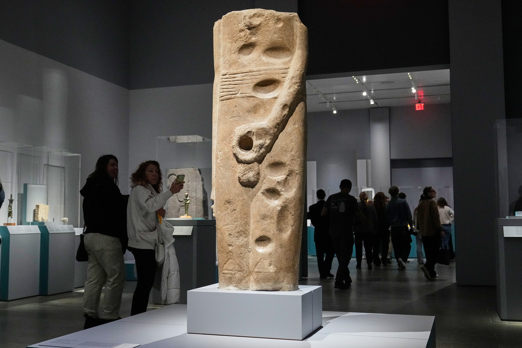 The colossal statue of Min is displayed in the Divine Egypt exhibition, at the Metropolitan Museum of Art, in New York, Tuesday, Oct. 14, 2025. (AP Photo/Richard Drew)