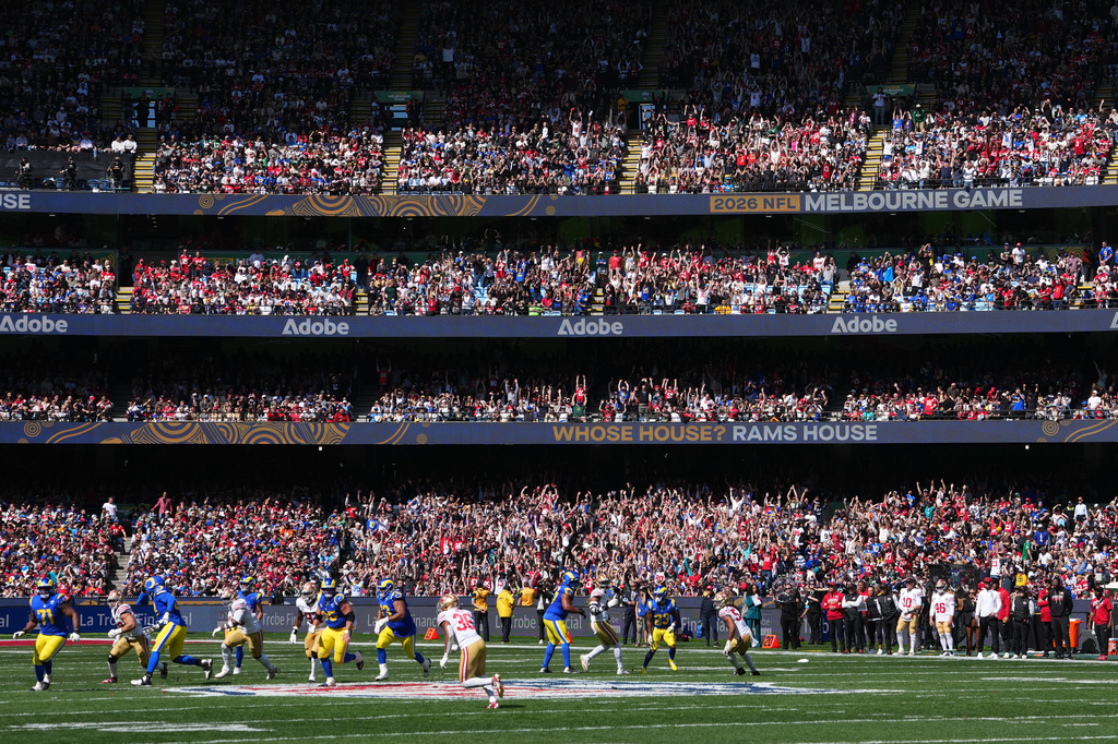 Fans watch during the second half of an NFL football game between the Los Angeles Rams and the San Francisco 49ers, Friday, Sept. 11, 2026, in Melbourne, Australia. (AP Photo/Scott Barbour)