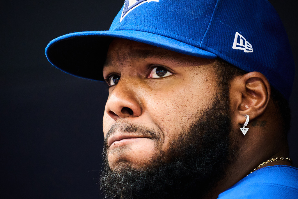 Toronto Blue Jays' Vladimir Guerrero Jr. looks out of the dugout before of a baseball game against the Baltimore Orioles in Toronto, Saturday, Sept. 12, 2026. (Sammy Kogan/The Canadian Press via AP)