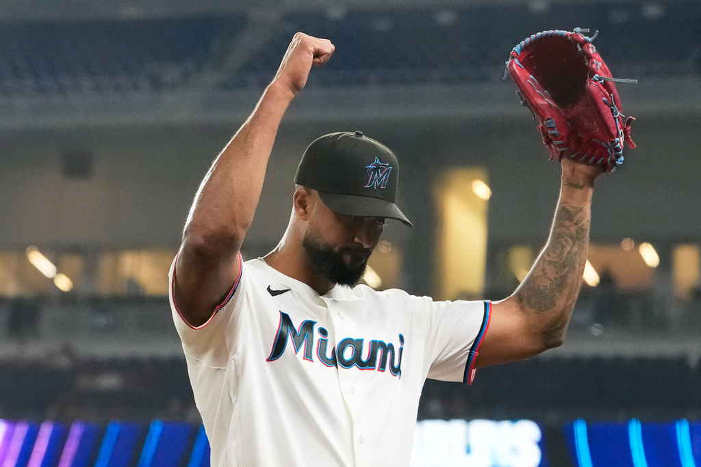 Miami Marlins starting pitcher Sandy Alcantara reacts after becoming the Marlins all time leader in strikeouts during the seventh inning of a baseball game against the Texas Rangers, Tuesday, June 23, 2026, in Miami. (AP Photo/Lynne Sladky)