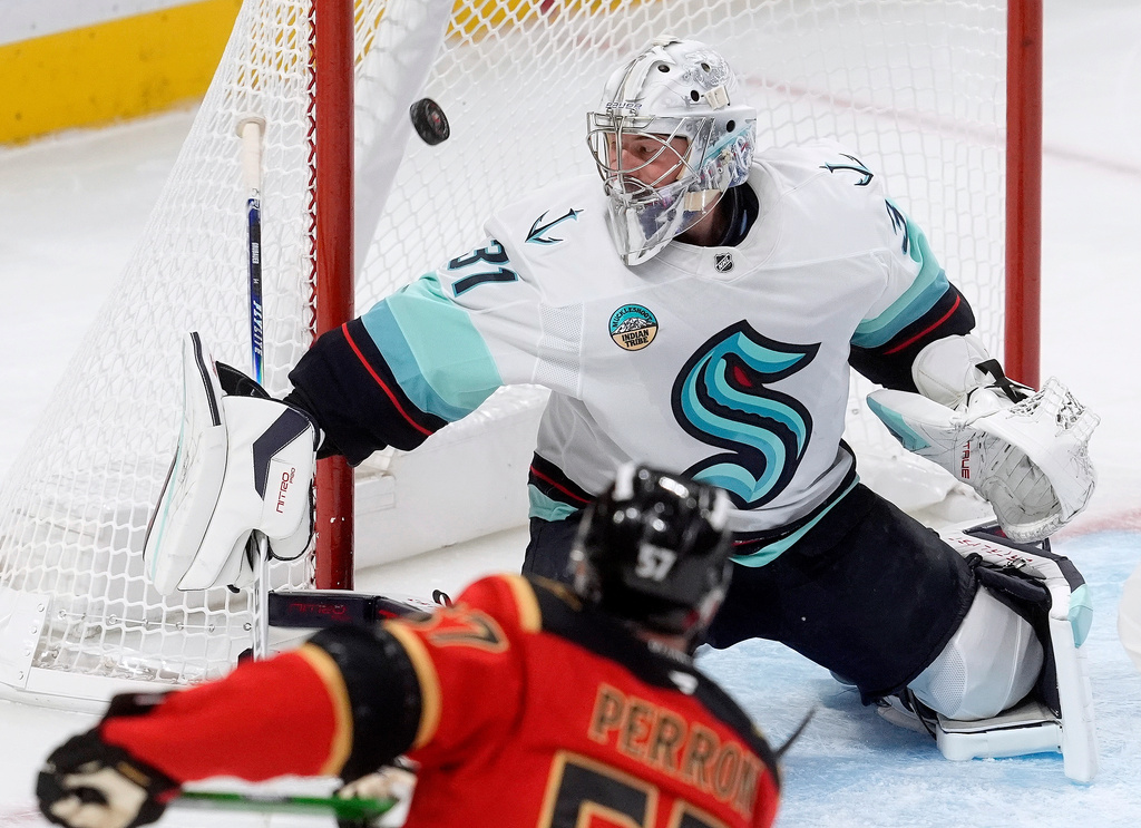 Ottawa Senators left wing David Perron (57) fires the puck past Seattle Kraken goaltender Philipp Grubauer (31) during first period NHL action in Ottawa, Thursday, Oct. 16, 2025. (Adrian Wyld/The Canadian Press via AP)