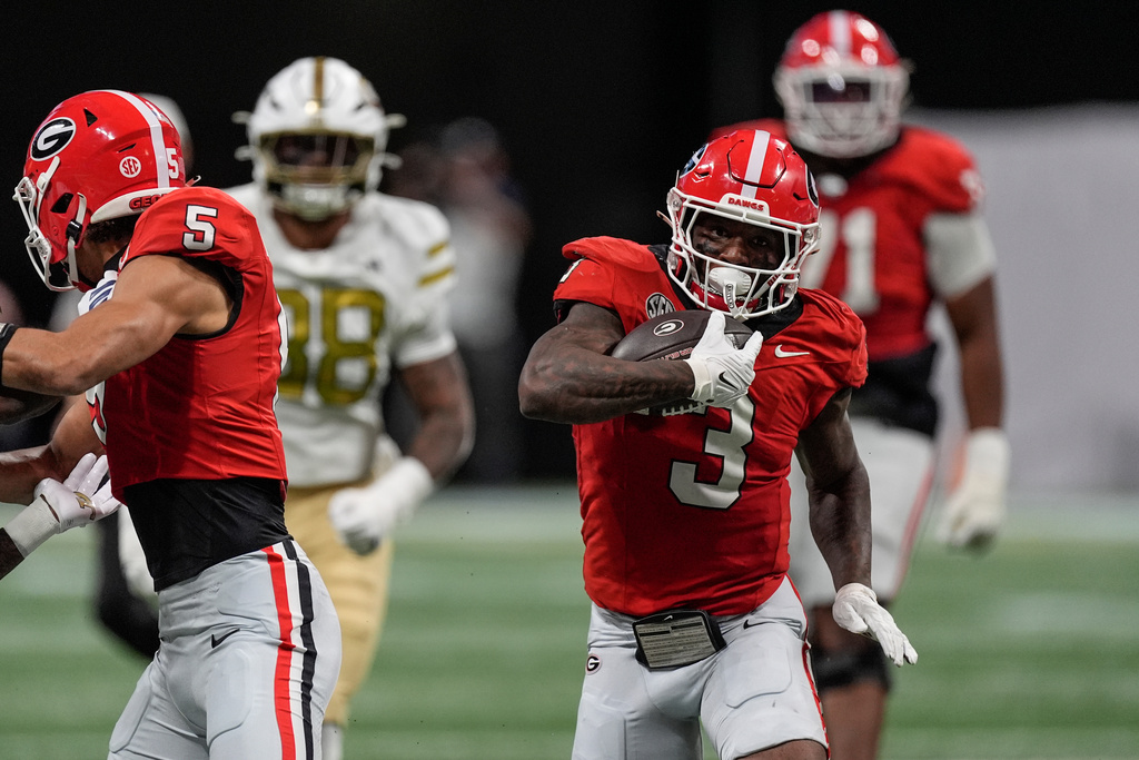 Georgia running back Nate Frazier (3) runs against Georgia Tech during the first half of an NCAA college football game, Friday, Nov. 28, 2025, in Atlanta. (AP Photo/Mike Stewart)