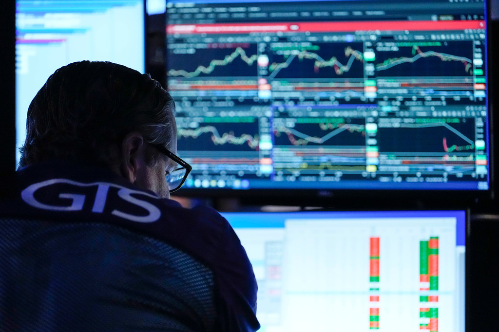 A trader works on the floor of the New York Stock Exchange, Thursday, July 30, 2026, in New York. (AP Photo/Yuki Iwamura)