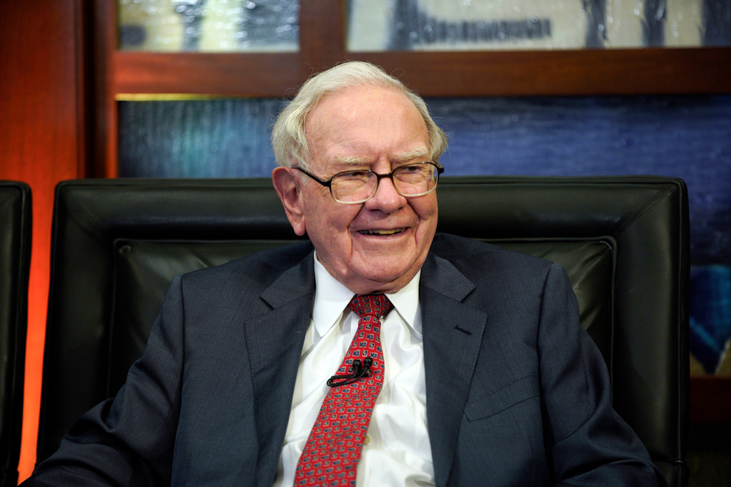 FILE- In this May 7, 2018, file photo, Berkshire Hathaway Chairman and CEO Warren Buffett smiles during an interview in Omaha, Neb.. (AP Photo/Nati Harnik, File)