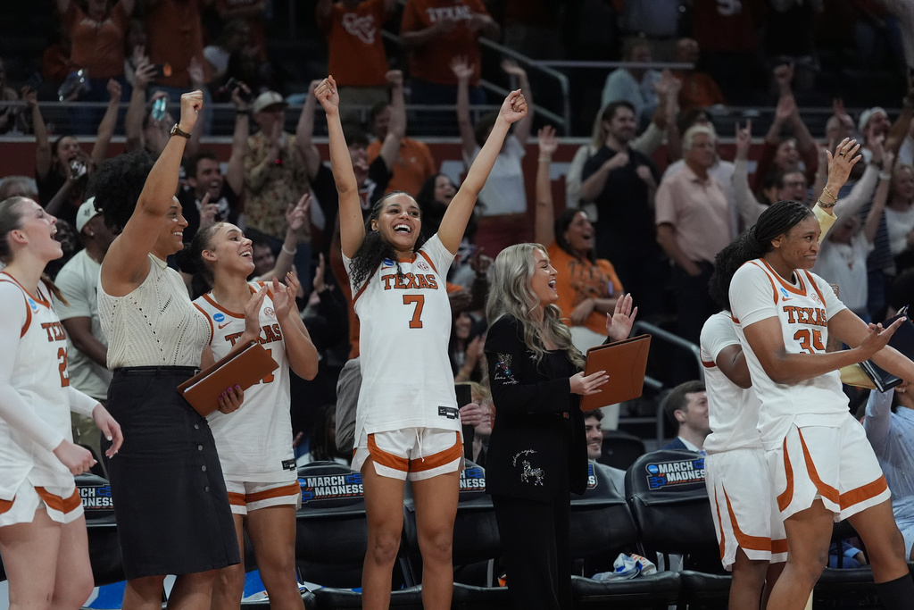 Texas guard Jordan Lee (7) and teammates celebrate during the second half in the first round of the NCAA college basketball tournament game against Missouri State, Friday, March 20, 2026. (AP Photo/Eric Gay)