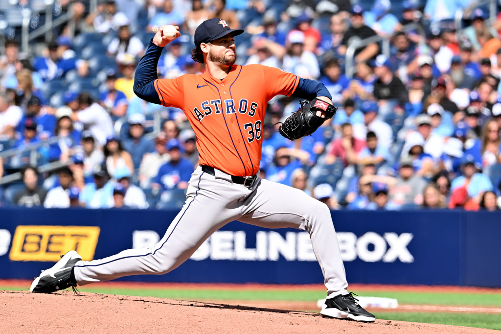 Houston Astros pitcher Peter Lambert (38) works against the Toronto Blue Jays during the first inning of a baseball game in Toronto on Tuesday, June 23, 2026. (Jon Blacker/The Canadian Press via AP)