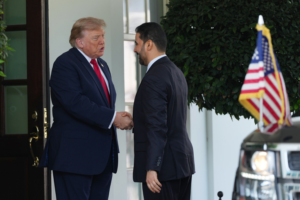 President Donald Trump greets Iraq's Prime Minister Ali al-Zaidi at the White House, Tuesday, July 14, 2026, in Washington. (AP Photo/Julia Demaree Nikhinson)