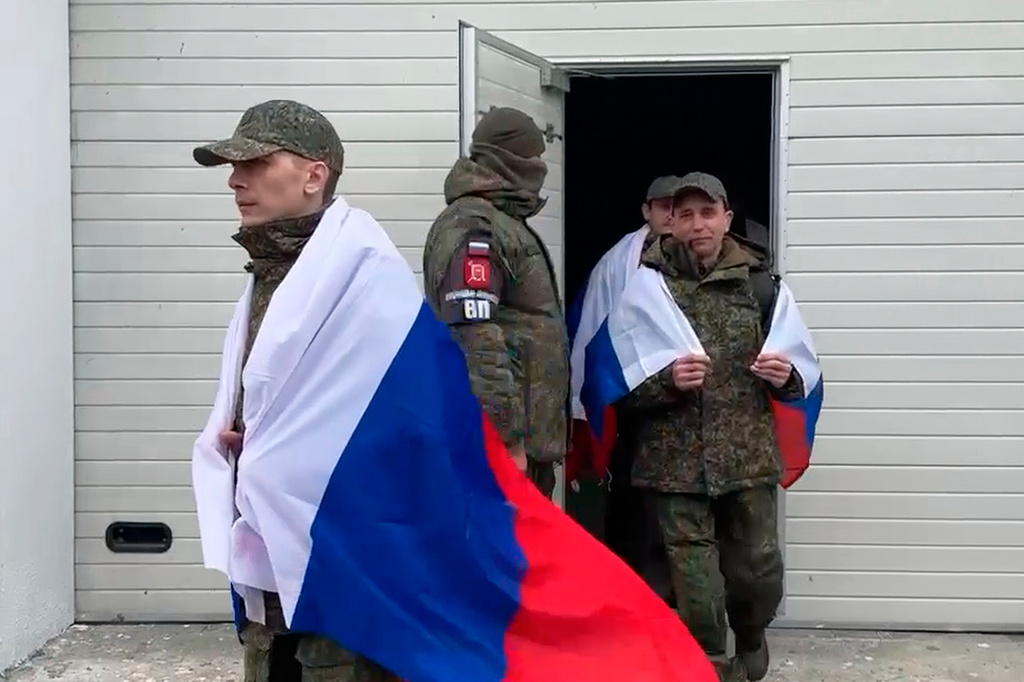 In this image taken from a video provided by Russian Defense Ministry Press Service on Saturday, April 11, 2026, Russian servicemen arrive at an undisclosed location in Belarus after returning from captivity during a POW exchange of a group of servicemen between Russia and Ukraine. (Russian Defense Ministry Press Service via AP)