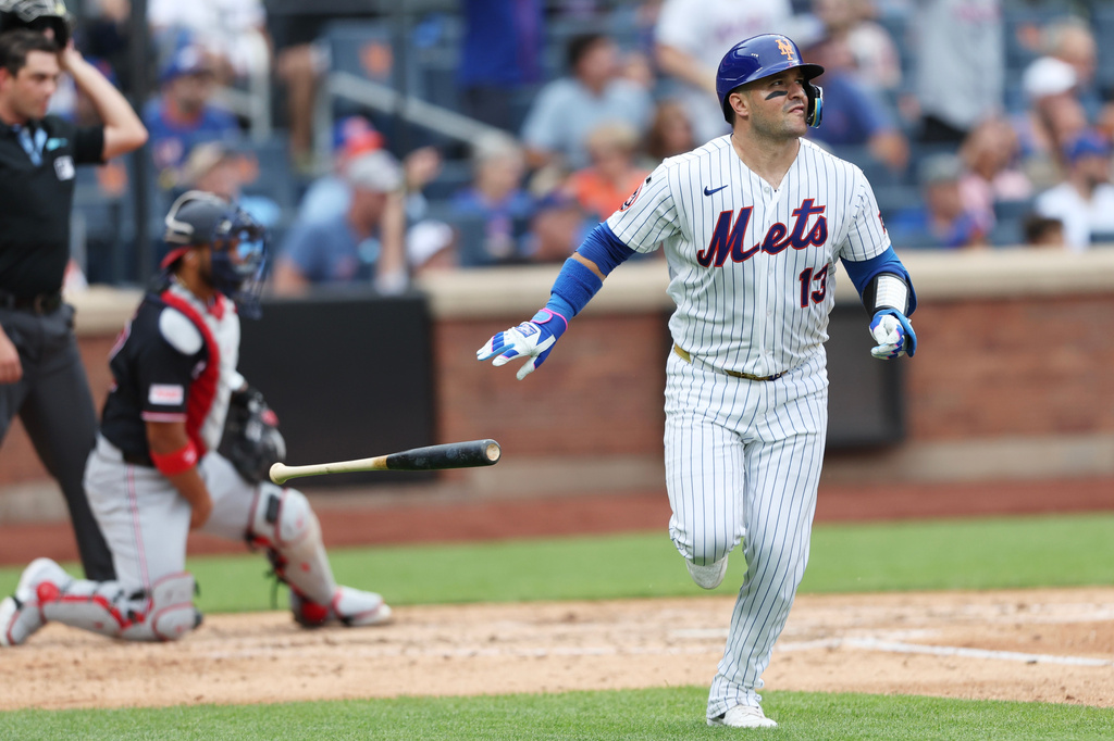 New York Mets' Luis Torrens (13) watches his home run during the fourth inning of a baseball game against the Washington Nationals, Sunday, Aug. 16, 2026, in New York. (AP Photo/Heather Khalifa)