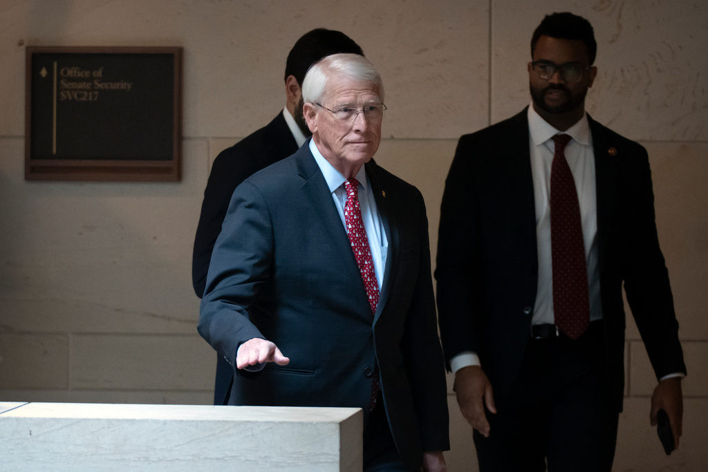 Senate Armed Services Committee chairman Sen. Roger Wicker, R-Miss., leaves after a meeting with U.S. Navy Adm. Frank M. Bradley on Capitol Hill, Thursday, Dec. 4, 2025, in Washington. (AP Photo/Mark Schiefelbein)