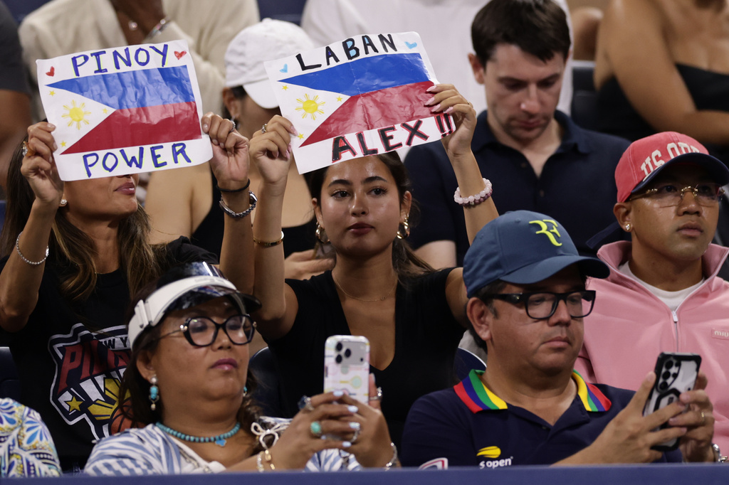 Fans of Alexandra Eala, of the Philippines, hold up signs during her match against Mary Stoiana, of the United States, in the first round of the U.S. Open tennis championships Tuesday, Sept. 1, 2026, in New York. (AP Photo/Adam Hunger)