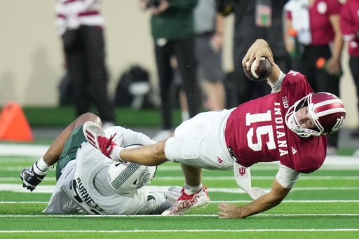 Indiana quarterback Fernando Mendoza (15) is tackled by Michigan State defensive lineman Kekai Burnett (51) during the second half of an NCAA college football game, Saturday, Oct. 18, 2025, in Bloomington, Ind. (AP Photo/AJ Mast) Indiana quarterback Fernando Mendoza (15) is tackled by Michigan State defensive lineman Kekai Burnett (51) during the second half of an NCAA college football game, Saturday, Oct. 18, 2025, in Bloomington, Ind. (AP Photo/AJ Mast)