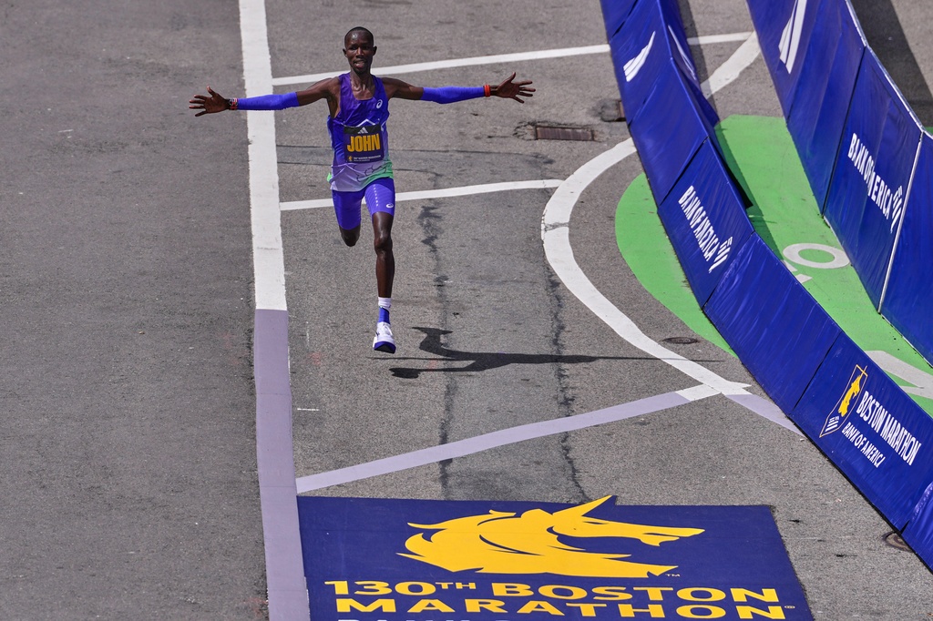 Boston Marathon winner John Korir of Kenya, celebrates while approaching the finish line, Monday, April 20, 2026, in Boston. (AP Photo/Charles Krupa)