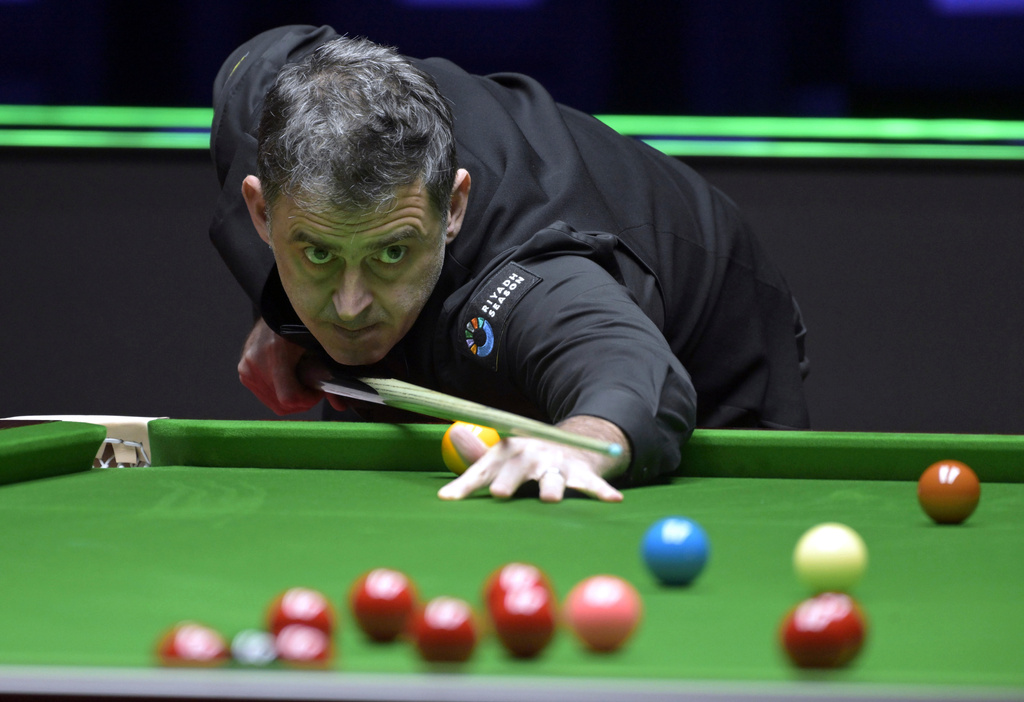 In this photo released by Xinhua News Agency, Ronnie O'Sullivan of England competes during the second round match against Xiao Guodong of China at the Snooker World Grand Prix 2026 in Hong Kong, Feb. 5, 2026. (Lo Ping Fai/Xinhua via AP)