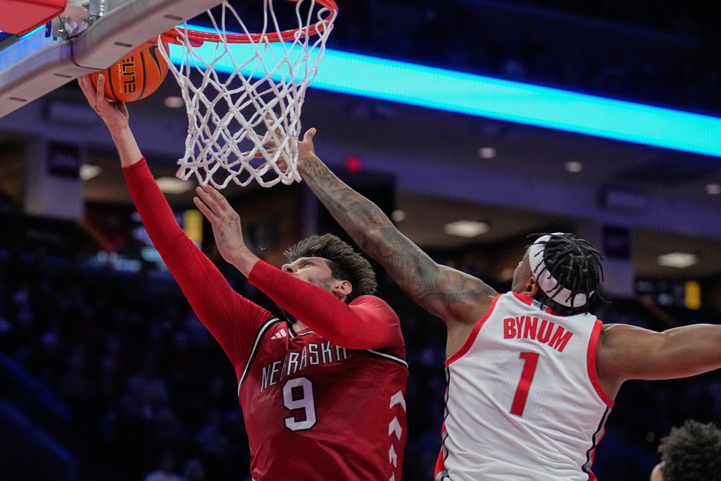 Nebraska forward Berke Buyuktuncel (9) shoots in front of Ohio State forward Amare Bynum (1) in the first half of an NCAA college basketball game Monday, Jan. 5, 2026, in Columbus, Ohio. (AP Photo/Sue Ogrocki)