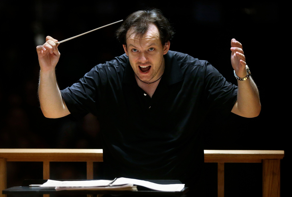 FILE - Boston Symphony Orchestra music director Andris Nelsons rehearses with the orchestra at Symphony Hall, Nov. 20, 2014, in Boston. (AP Photo/Steven Senne, File)