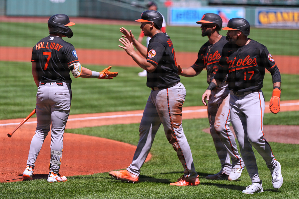 Baltimore Orioles players celebrate during a six-run first inning of a baseball game against the Boston Red Sox, Thursday, June 4, 2026, in Boston. (AP Photo/Charles Krupa)