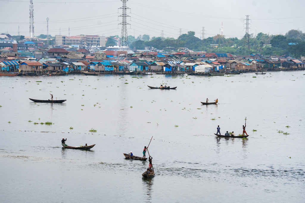 Fishermen in the lagoon in Lagos, Nigeria, on Saturday, Dec. 6, 2025. (AP Photo/Grace Ekpu)