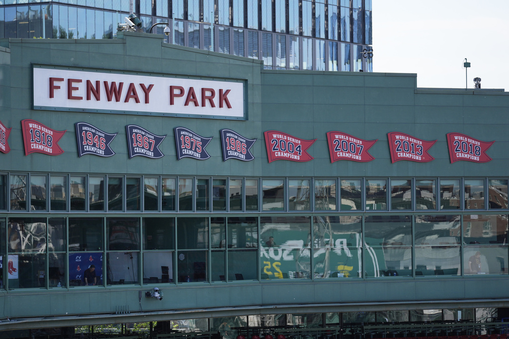 The press box is decorated with championship penants at Fenway Park, Tuesday, June 3, 2025, in Boston. (AP Photo/Robert F. Bukaty)