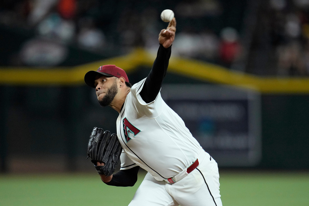 Arizona Diamondbacks starting pitcher Eduardo Rodriguez throws against the San Diego Padres during the first inning of a baseball game, Tuesday, Aug. 4, 2026, in Phoenix. (AP Photo/Ross D. Franklin)