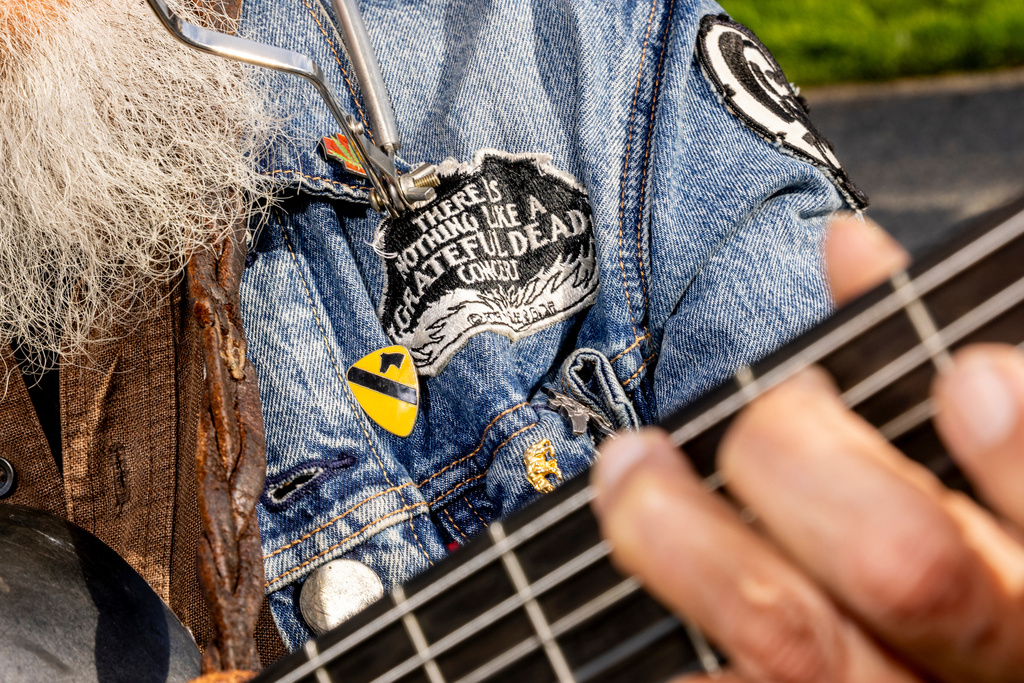 Steven Lewis, a third-generation Bay Area native, plays a guitar during a public memorial for Grateful Dead co-founder Bob Weir at Civic Center Plaza in San Francisco, Saturday, Jan. 17, 2026. (Stephen Lam/San Francisco Chronicle via AP)
