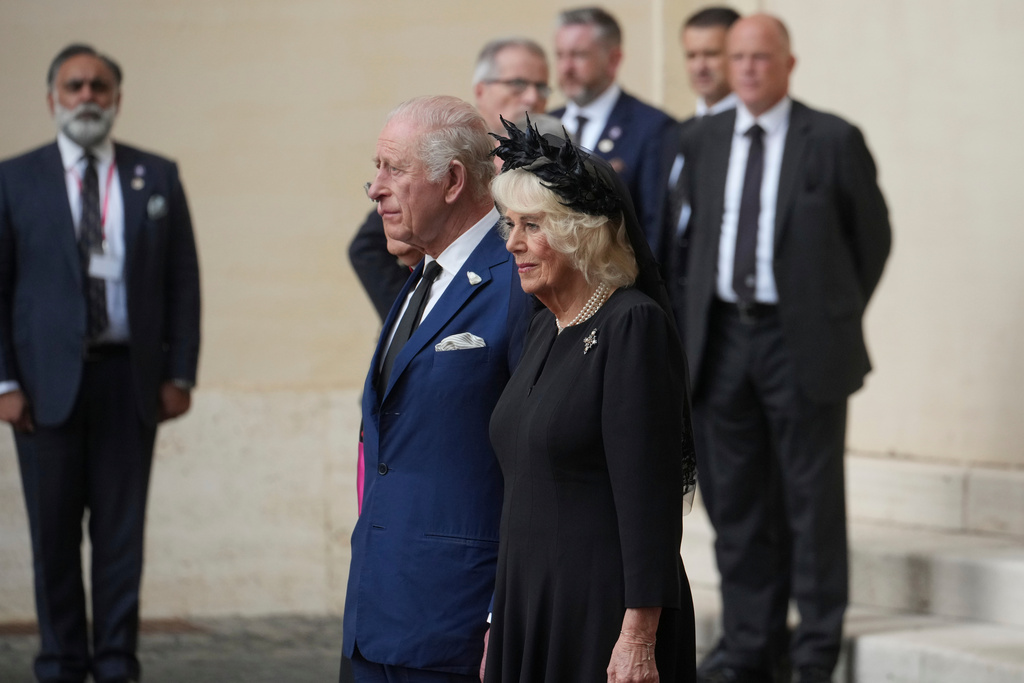 Britain's King Charles III and Queen Camilla listen national anthems in the St. Damasus Courtyard at the Vatican for a state visit, where they will meet with Pope Leo XIV and pray with him in the Sistine Chapel, Thursday, Oct. 23, 2025. (AP Photo/Andrew Medichini)