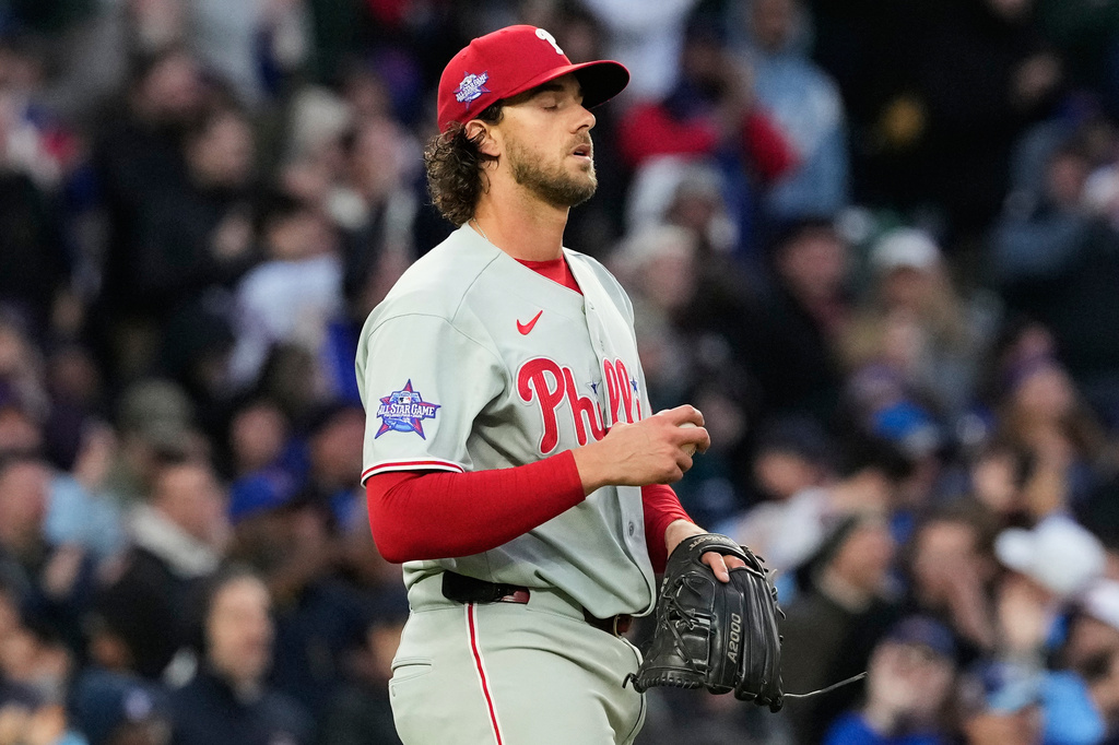 Philadelphia Phillies starting pitcher Aaron Nola reacts after Chicago Cubs' Dansby Swanson hit a three-run home run during the second inning of a baseball game, in Chicago, Monday, April 20, 2026. (AP Photo/Nam Y. Huh)