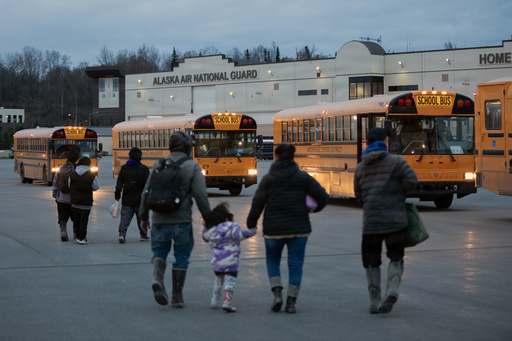 In this photo provided by the Alaska National Guard, Alaskans from West Coast communities board buses after arriving at Joint Base Elmendorf-Richardson, Alaska, Wednesday, Oct. 15, 2025. (Alejandro Pena/Alaska National Guard via AP) In this photo provided by the Alaska National Guard, Alaskans from West Coast communities board buses after arriving at Joint Base Elmendorf-Richardson, Alaska, Wednesday, Oct. 15, 2025. (Alejandro Pena/Alaska National Guard via AP)