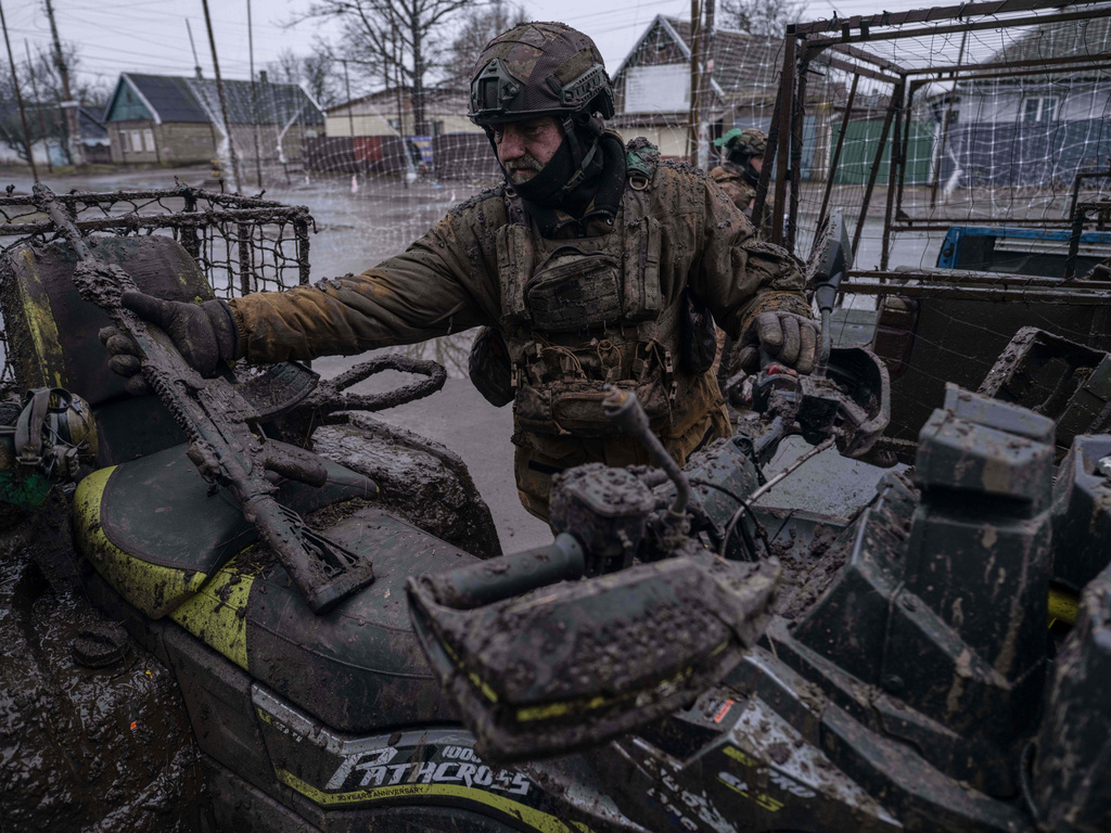 In this photo provided by Ukraine's 93rd Kholodnyi Yar Separate Mechanized Brigade press service, a serviceman returns from his mission in Donetsk region, Ukraine, Saturday, Jan. 31, 2026. (Iryna Rybakova/Ukraine's 93rd Mechanized Brigade via AP)